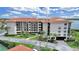 Condo building featuring multi-story living, tropical landscaping and beautiful waterfront views at 1810 Mariner Dr # 207, Tarpon Springs, FL 34689