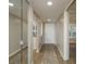 Hallway with mirror and views to multiple rooms at 1810 Mariner Dr # 207, Tarpon Springs, FL 34689