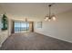 Spacious living room with access to a balcony overlooking the water at 1810 Mariner Dr # 207, Tarpon Springs, FL 34689