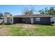 View of the backyard, showing the building's exterior and landscaping at 1828 Stancel Dr, Clearwater, FL 33764