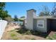 Backyard showcasing a hot tub, patio furniture, chimney and privacy fence at 1828 Stancel Dr, Clearwater, FL 33764