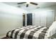 Bright bedroom with dark wood floors and a closet with sliding doors at 1828 Stancel Dr, Clearwater, FL 33764