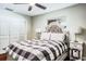 Bright bedroom with an upholstered headboard and modern lamps at 1828 Stancel Dr, Clearwater, FL 33764