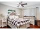 Cozy bedroom with a decorative headboard, matching nightstands, and a dresser at 1828 Stancel Dr, Clearwater, FL 33764
