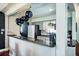Kitchen with hanging pot rack, granite countertops and stainless appliances at 1828 Stancel Dr, Clearwater, FL 33764