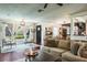 A living room with a large window lets in natural light, complementing the dark wood floors at 1828 Stancel Dr, Clearwater, FL 33764