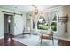 Well-lit sitting room featuring wood floors and stylish barn doors at 1828 Stancel Dr, Clearwater, FL 33764
