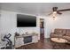 Cozy living room with dark wood floors and a ceiling fan at 1828 Stancel Dr, Clearwater, FL 33764