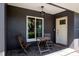 Covered porch with outdoor seating area, perfect for enjoying the outdoors at 1828 Stancel Dr, Clearwater, FL 33764