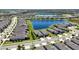 Aerial view showcasing the home's lakeside location and neighborhood layout at 19212 Iron Topsail Isle, Land O Lakes, FL 34638