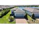 Aerial view of a single Gathering home with a two-car garage and brick driveway at 19212 Iron Topsail Isle, Land O Lakes, FL 34638