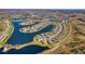 Stunning aerial view of a lakeside community with well-maintained homes and picturesque scenery at 19212 Iron Topsail Isle, Land O Lakes, FL 34638
