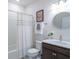 Bathroom showcasing a vanity, toilet, and shower/tub combo with a white shower curtain at 19212 Iron Topsail Isle, Land O Lakes, FL 34638