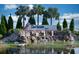 Scenic Del Webb Bexley community entrance featuring a stone waterfall and lush landscaping at 19212 Iron Topsail Isle, Land O Lakes, FL 34638