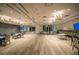 Large community room with tables and chairs, TV screens, and access to a catering kitchen at 19212 Iron Topsail Isle, Land O Lakes, FL 34638