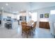 Open-concept space showcasing the dining area and kitchen with sleek stainless appliances at 19212 Iron Topsail Isle, Land O Lakes, FL 34638