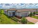 Charming single-Gathering home with a well-maintained lawn, brick driveway, and inviting curb appeal at 19212 Iron Topsail Isle, Land O Lakes, FL 34638