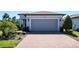 Close up on the brick driveway and the garage of this charming single-Gathering home at 19212 Iron Topsail Isle, Land O Lakes, FL 34638