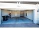 A clean two-car garage features a high ceiling, a finished interior, and an automatic door opener at 19212 Iron Topsail Isle, Land O Lakes, FL 34638