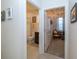 Hallway view showing access to bathroom and bedroom, each with unique décor, adding character to the living space at 19212 Iron Topsail Isle, Land O Lakes, FL 34638