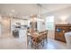 Spacious kitchen and dining area featuring stainless appliances and tiled floors at 19212 Iron Topsail Isle, Land O Lakes, FL 34638