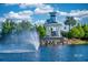 Scenic lake view featuring a charming Del Webb gazebo and fountain, perfect for relaxation at 19212 Iron Topsail Isle, Land O Lakes, FL 34638