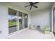 Relaxing screened lanai with Adirondack chairs offering views of the backyard and lake at 19212 Iron Topsail Isle, Land O Lakes, FL 34638