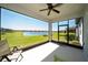 Relaxing screened-in lanai with views of the serene lake at 19212 Iron Topsail Isle, Land O Lakes, FL 34638