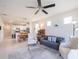 Open-concept living area with connecting dining and kitchen at 19212 Iron Topsail Isle, Land O Lakes, FL 34638