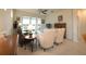 Cozy living room featuring large sliding glass doors and comfortable seating at 19212 Iron Topsail Isle, Land O Lakes, FL 34638