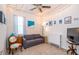 Cozy living room featuring a sofa, charming decor, and warm lighting, perfect for relaxation at 19212 Iron Topsail Isle, Land O Lakes, FL 34638