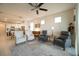 Inviting living room area with comfortable seating, open floor plan, and easy access to the kitchen and dining area at 19212 Iron Topsail Isle, Land O Lakes, FL 34638