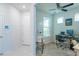 Bright and functional office space featuring a ceiling fan, large window, desk, and a whiteboard for brainstorming at 19212 Iron Topsail Isle, Land O Lakes, FL 34638