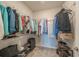 Spacious walk-in closet with ample shelving for storage of clothes, shoes, and luggage at 19212 Iron Topsail Isle, Land O Lakes, FL 34638