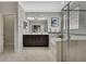 Bathroom featuring a soaking tub, a walk-in shower, a double vanity, and an entrance to the bedroom at 19793 Long Lake Ranch Blvd, Lutz, FL 33558