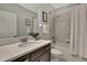 Bathroom featuring a shower-tub combination, modern vanity, and neutral decor at 19793 Long Lake Ranch Blvd, Lutz, FL 33558