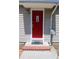 Close-up of the red front door with decorative glass, brick steps, and silver mailbox at 2109 52Nd N Ave, St Petersburg, FL 33714