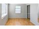 Bright living room with a closet, wood-look floors, and natural light from the window at 2109 52Nd N Ave, St Petersburg, FL 33714