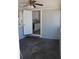 The sunroom has a ceiling fan, entry to kitchen, and natural light at 2109 52Nd N Ave, St Petersburg, FL 33714