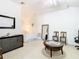 Bright bedroom featuring vaulted ceilings, neutral carpet, and a sitting area at 2327 Shirecrest Cove Way, Lutz, FL 33558