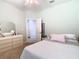 Inviting bedroom showcasing neutral tones and decor at 2327 Shirecrest Cove Way, Lutz, FL 33558