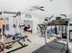 Spacious home gym equipped with various workout machines and weights, providing a convenient fitness space at 2327 Shirecrest Cove Way, Lutz, FL 33558