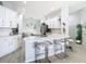 Spacious kitchen with seating, island, stainless steel appliances, and white countertops at 2327 Shirecrest Cove Way, Lutz, FL 33558