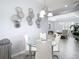 Cozy dining nook features modern decor and a glass table, perfect for intimate meals at 2327 Shirecrest Cove Way, Lutz, FL 33558