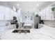 Open kitchen design with island, stainless steel appliances, and modern countertops at 2327 Shirecrest Cove Way, Lutz, FL 33558