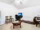 Cozy living room featuring neutral tones, a ceiling fan, and comfortable seating, perfect for relaxing or entertaining guests at 2327 Shirecrest Cove Way, Lutz, FL 33558