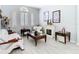 Cozy living room features a fireplace, shuttered windows, and modern furniture, creating a comfortable and inviting atmosphere at 2327 Shirecrest Cove Way, Lutz, FL 33558