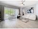 Spacious living room with sliding glass doors leading to the backyard and modern furnishings at 2327 Shirecrest Cove Way, Lutz, FL 33558