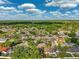 Areal shot showing a community with mature trees, well-maintained lawns and in ground pools at 2329 Towering Oaks Cir, Seffner, FL 33584