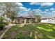 A beautiful view of the home's backyard, and landscaping at 2329 Towering Oaks Cir, Seffner, FL 33584